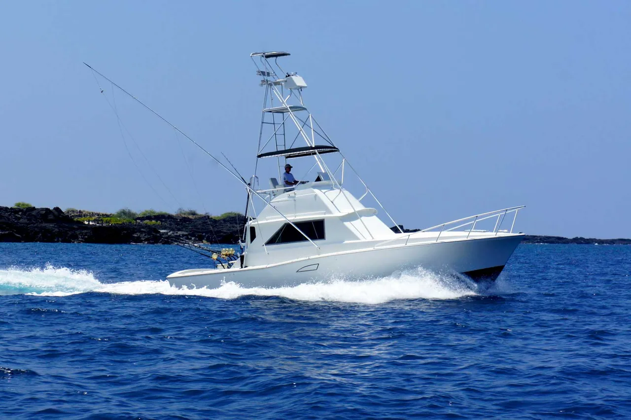Marlin Grando, a 38’ Bertram fishing charter boat, at sea off Kona, Hawaii